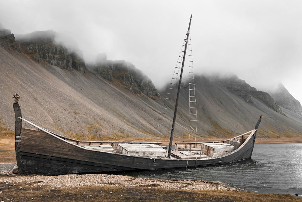 a boat sitting on top of a body of water