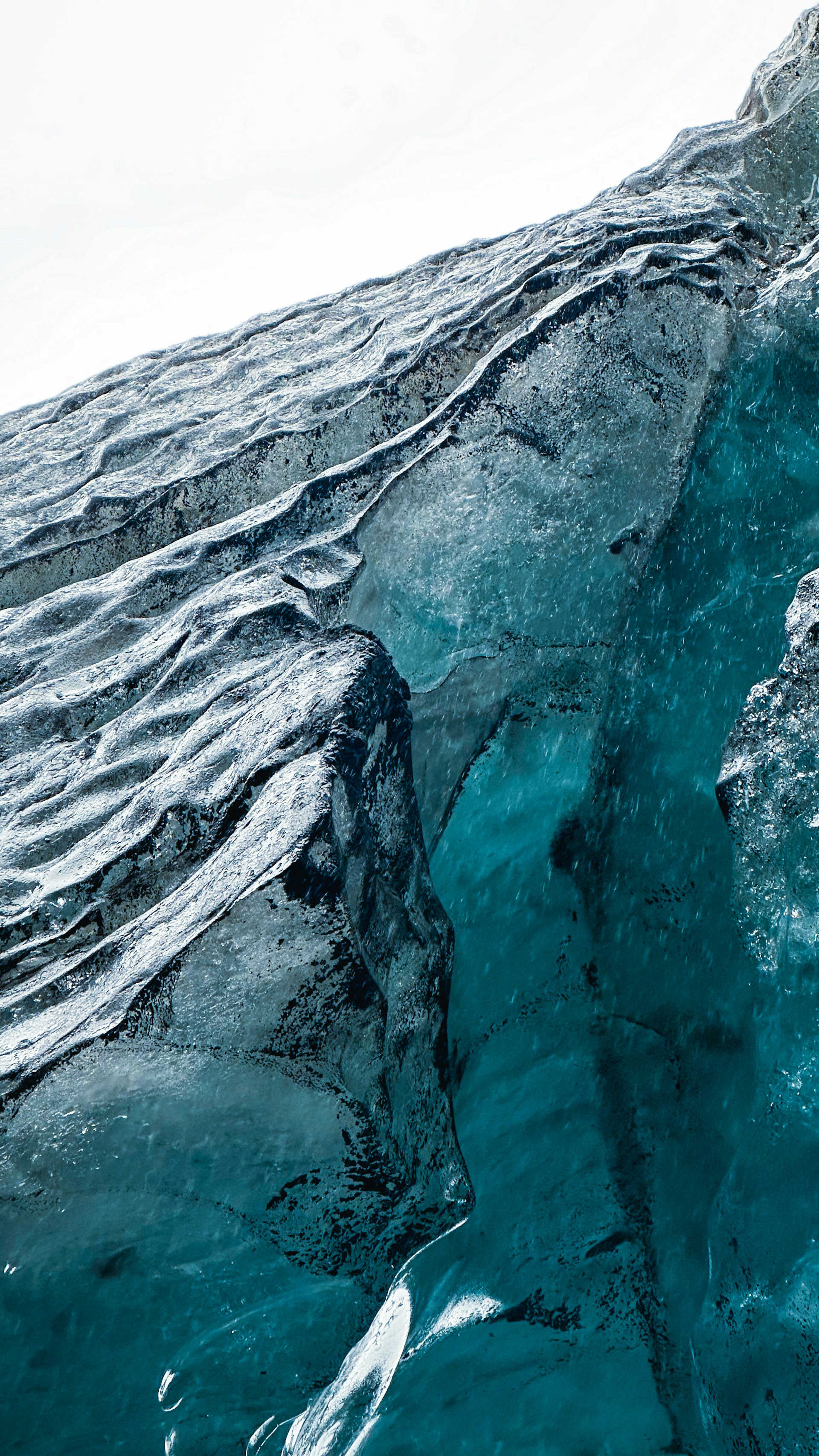 a large iceberg floating on top of a body of water