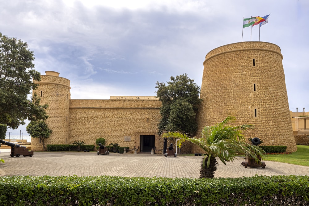 a large brick building with a flag on top of it