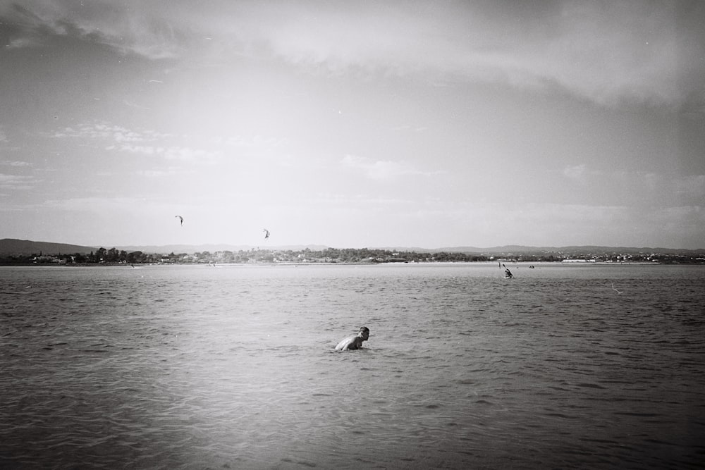 a person swimming in a large body of water