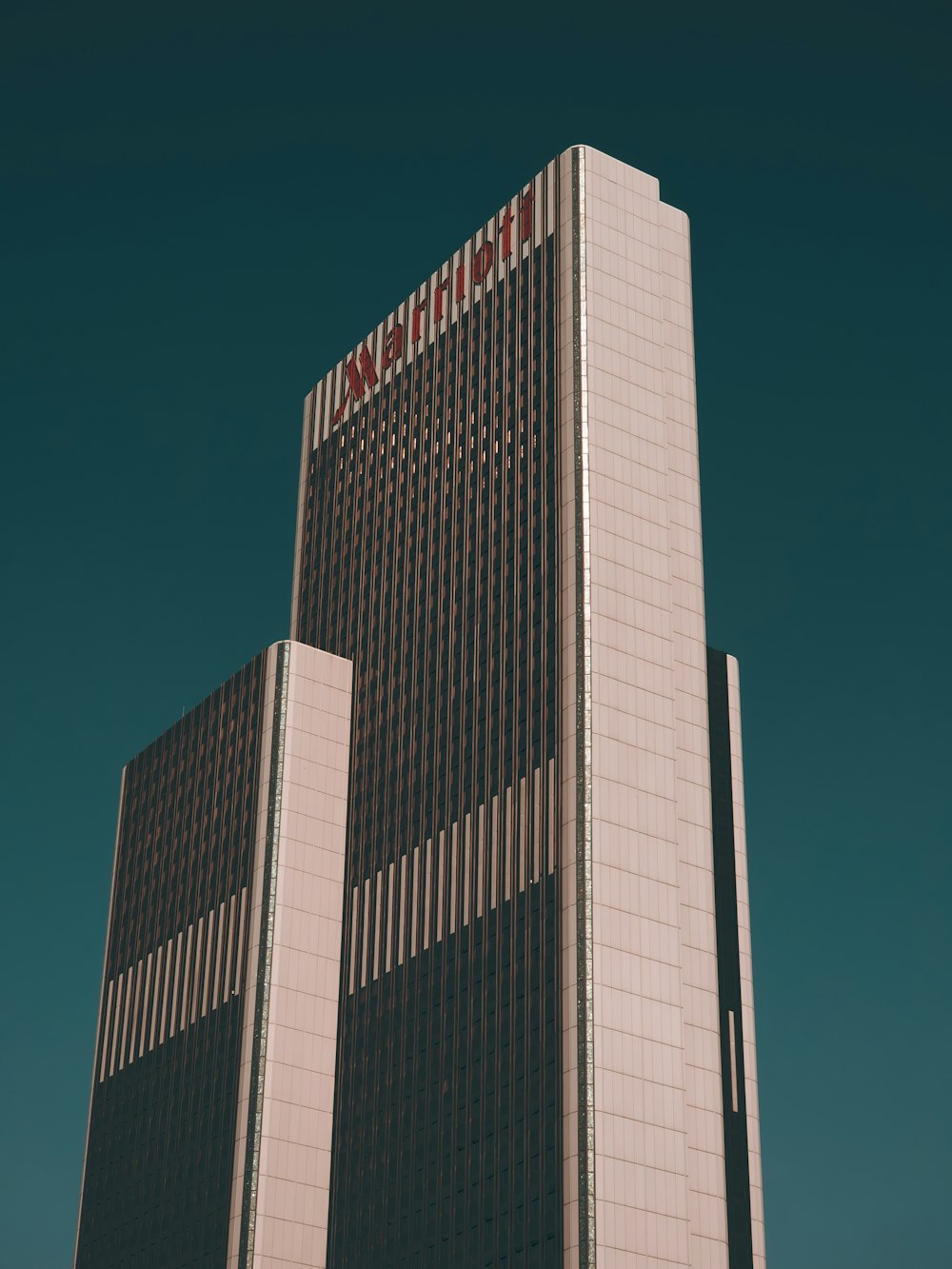 a tall building with a sign on top of it