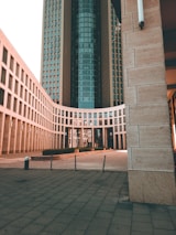 a large building with a clock tower in the background