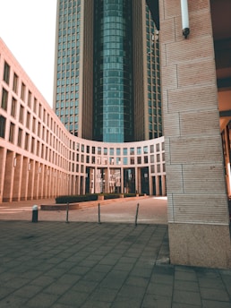 a large building with a clock tower in the background