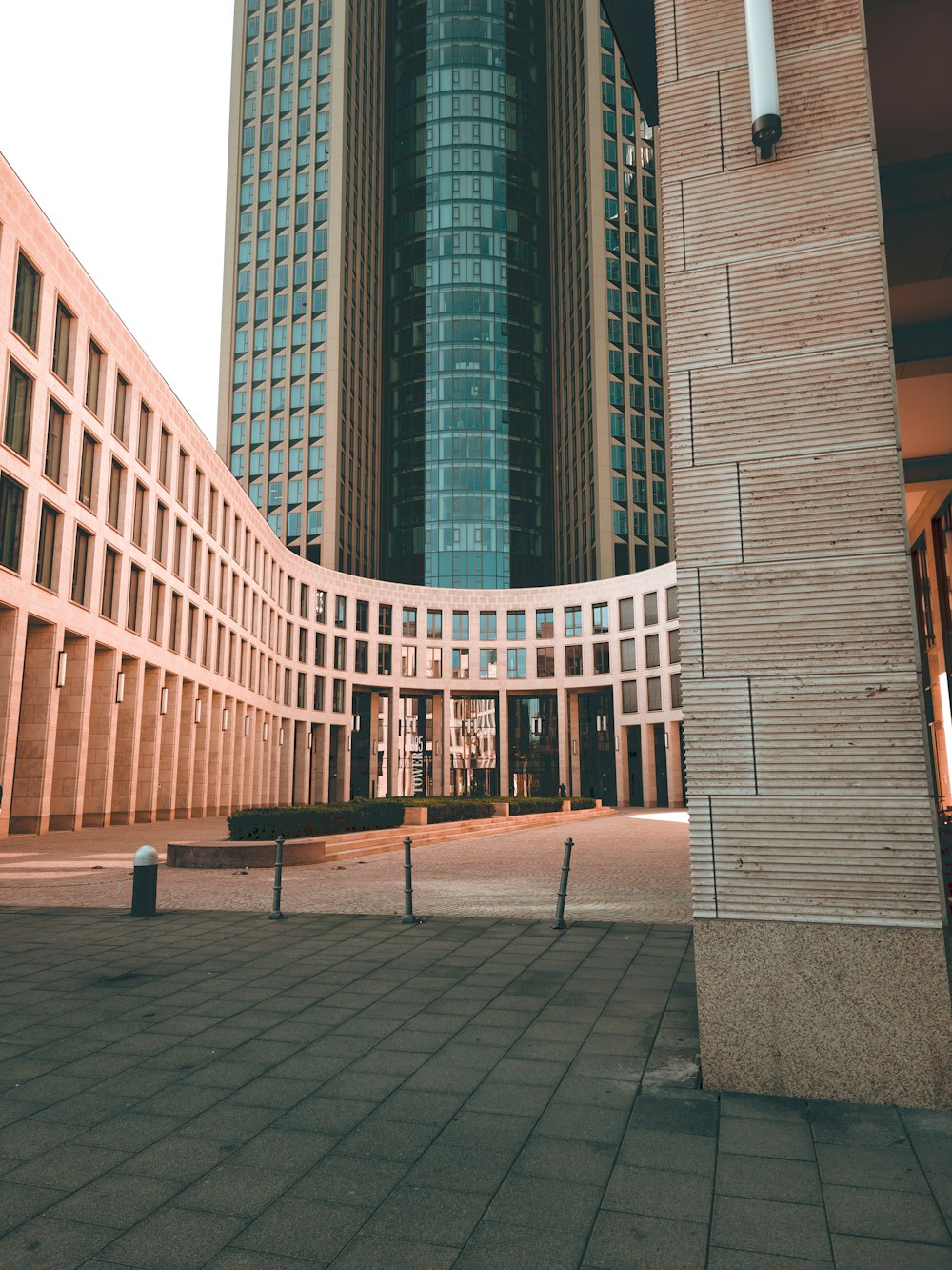 a large building with a clock tower in the background