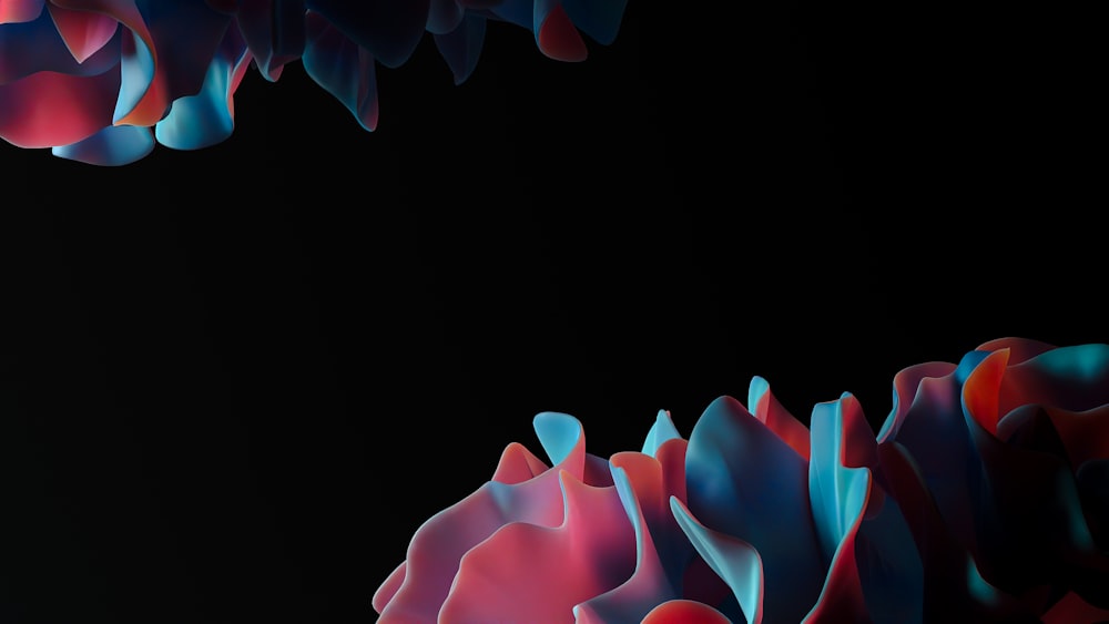 a black background with red, blue, and pink flowers