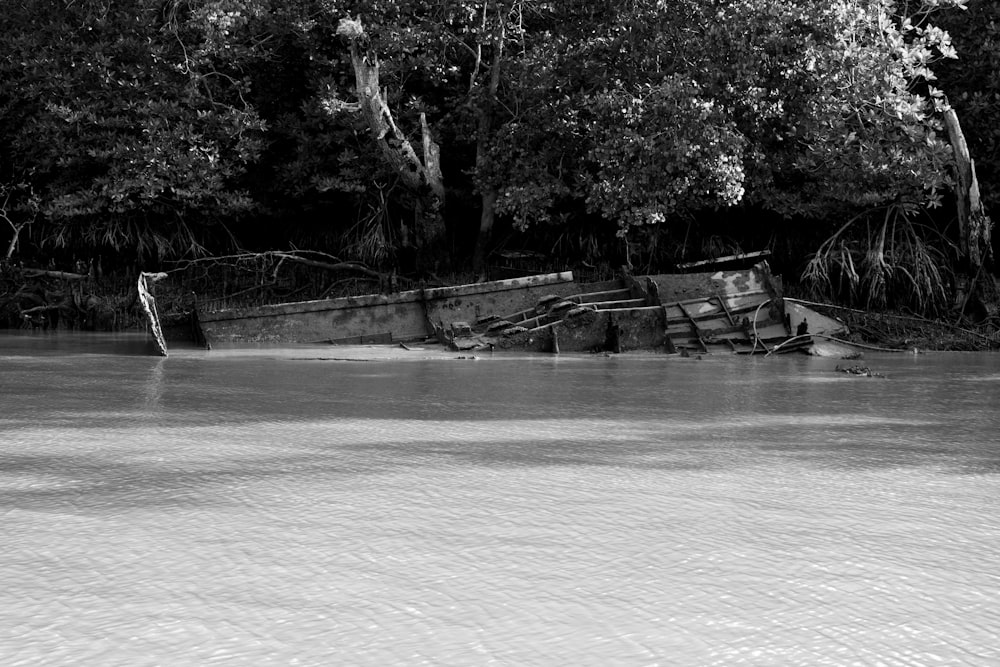 a black and white photo of a boat in the water