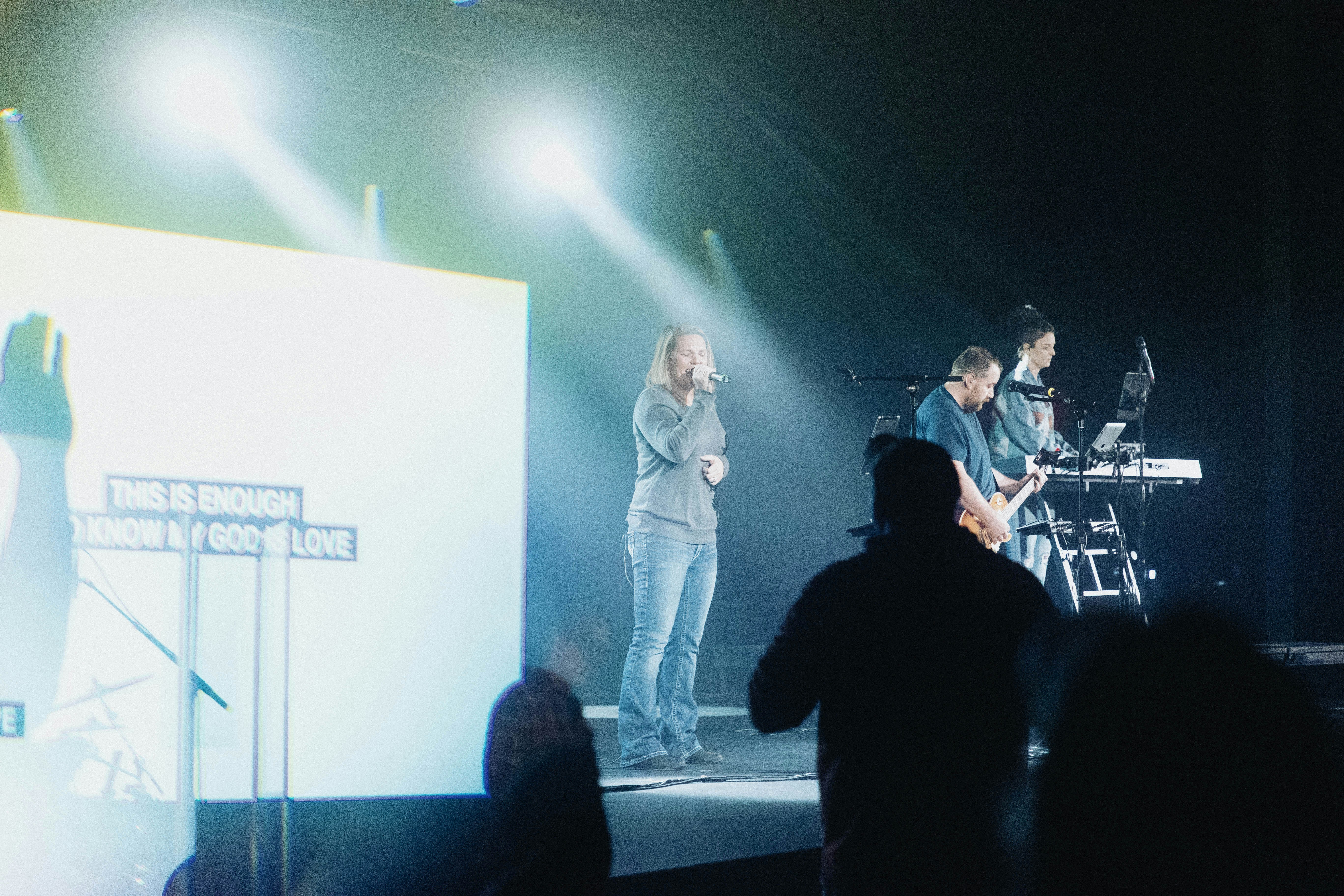 a group of men standing on top of a stage
