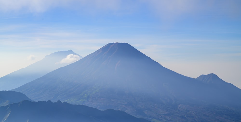 a large mountain with a very tall peak