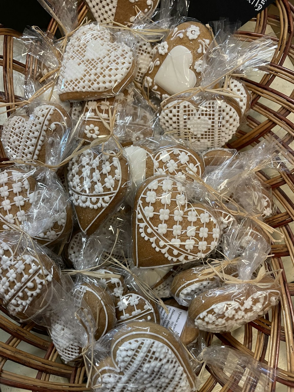 a basket filled with lots of heart shaped cookies