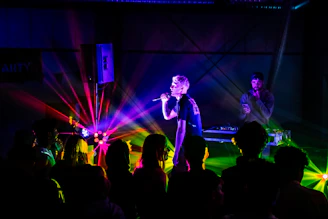 Birthday party scene with colorful lights and clear audio equipment