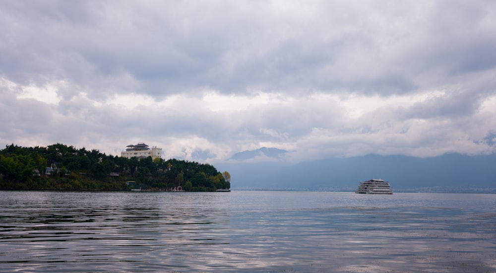 a cruise ship is in the distance on the water