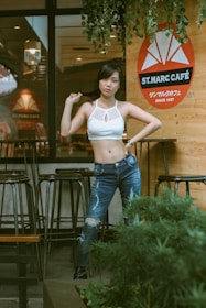 A graceful model in stylish denim and heels at a café.