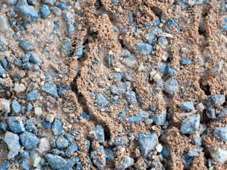 Close-up of textured ground covering materials arranged neatly.