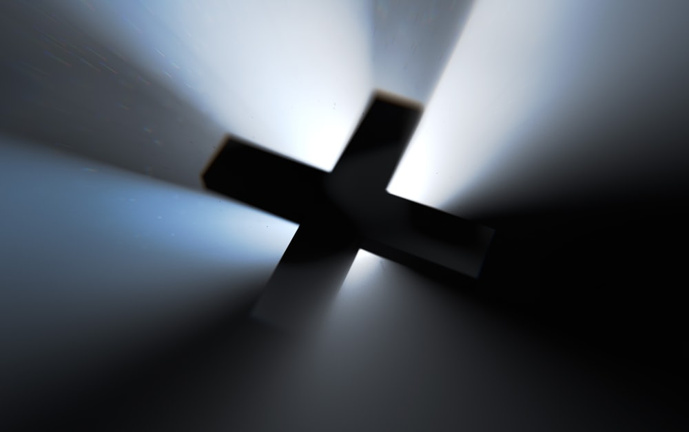 a blurry photo of a cross on a wall