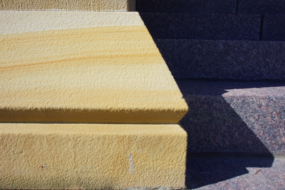 a close up of some steps with a cat sitting on one of them