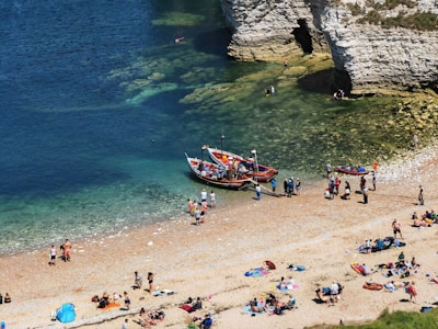 A vibrant community gathering on a sunny beach.
