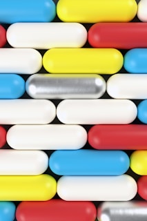 View of interconnected L-shaped capsules creating a modern geometric pattern.