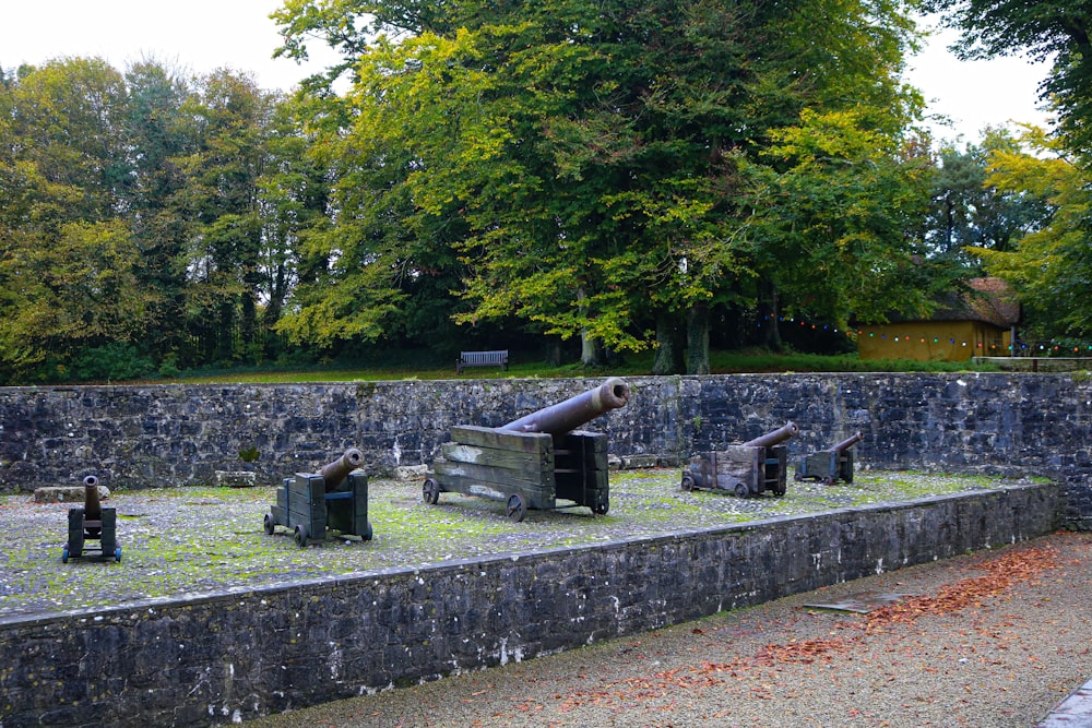 a stone wall with a cannon on top of it