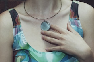 a close up of a person wearing a necklace