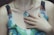 a close up of a person wearing a necklace