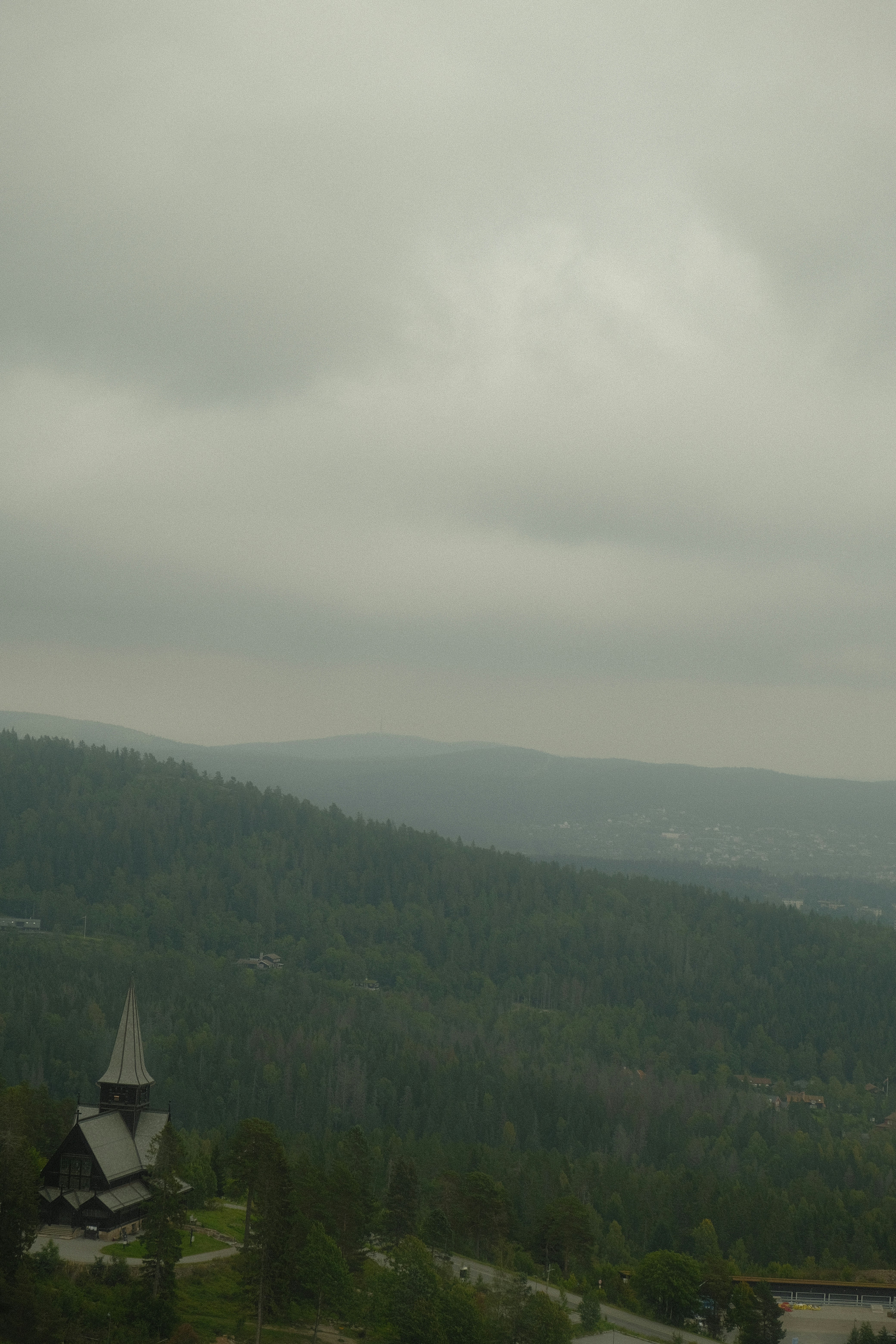 a view of a mountain with a church in the foreground