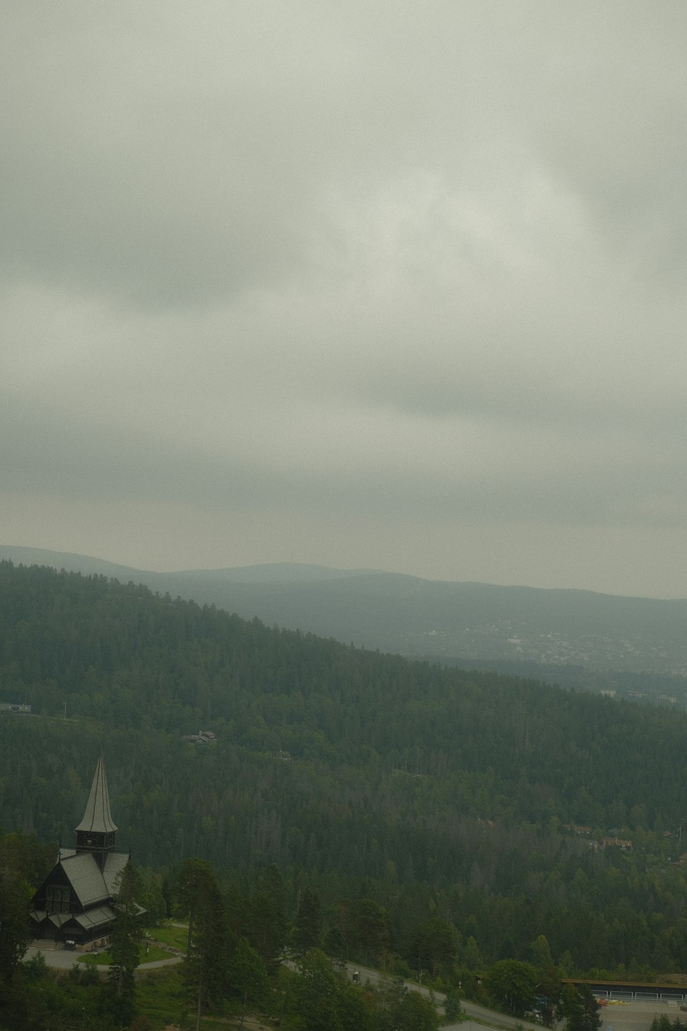 a view of a mountain with a church in the foreground