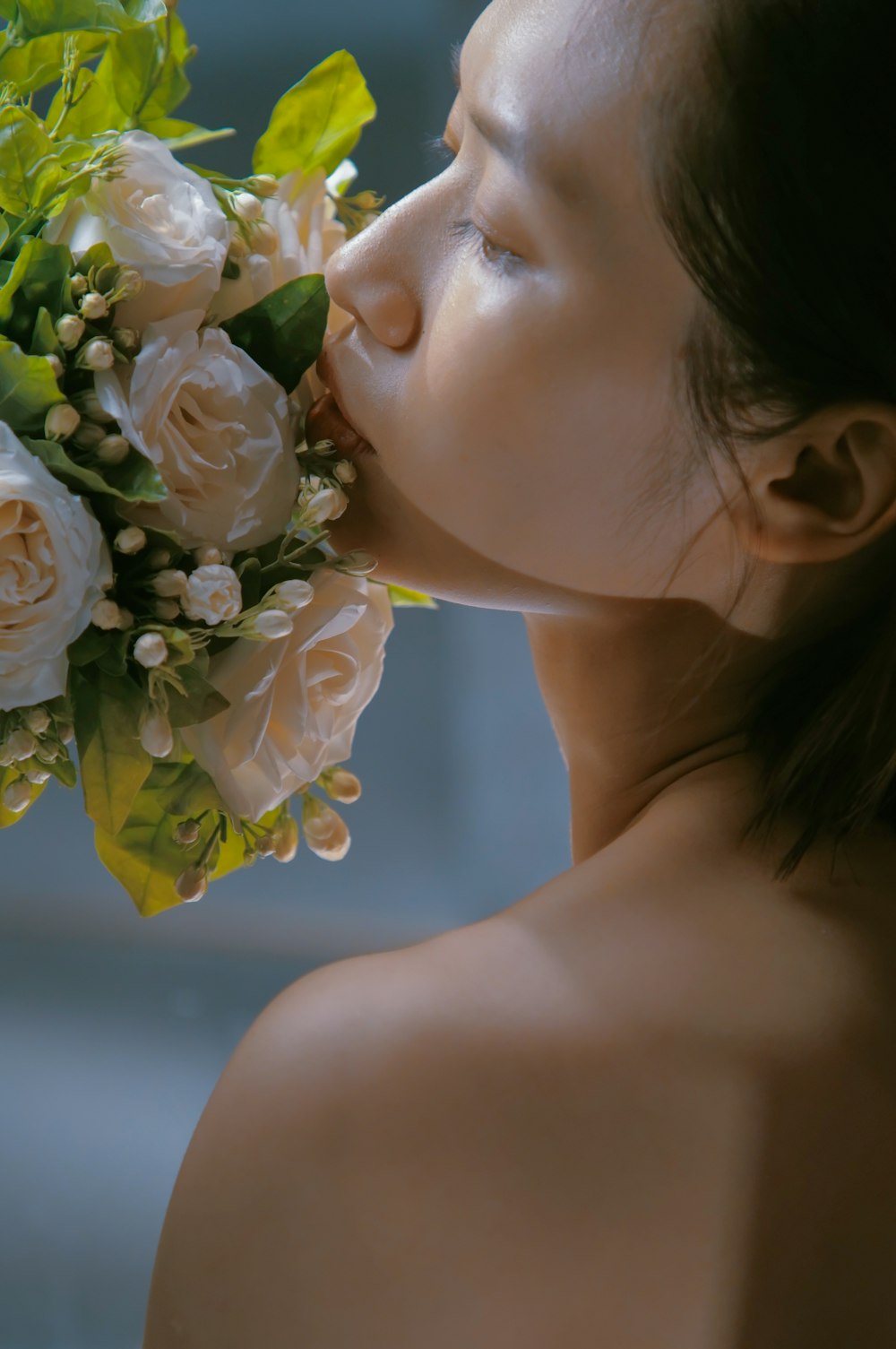 a woman with a bouquet of flowers in her mouth