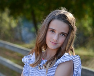 a young girl is posing for a picture