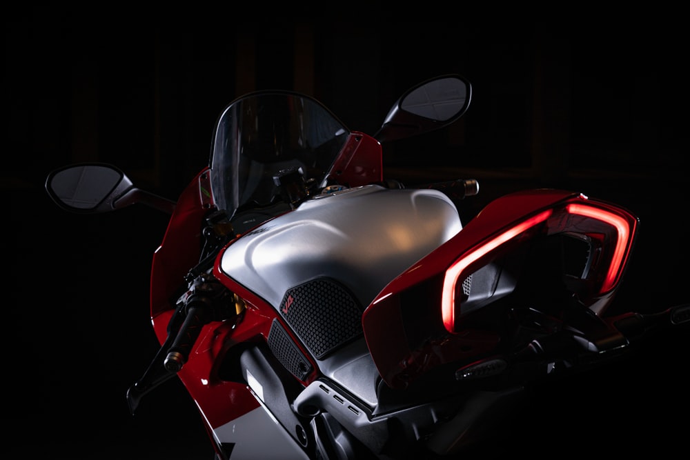 a close up of a motorcycle in the dark
