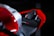A close-up view of a motorcycle seat and rear section. The design is sleek and modern, featuring angular shapes with a red and black color scheme. The V4 R branding is visible on the seat, indicating a high-performance model.