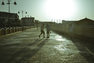 A stylish couple enjoying a sunset walk along the Thames embankment.