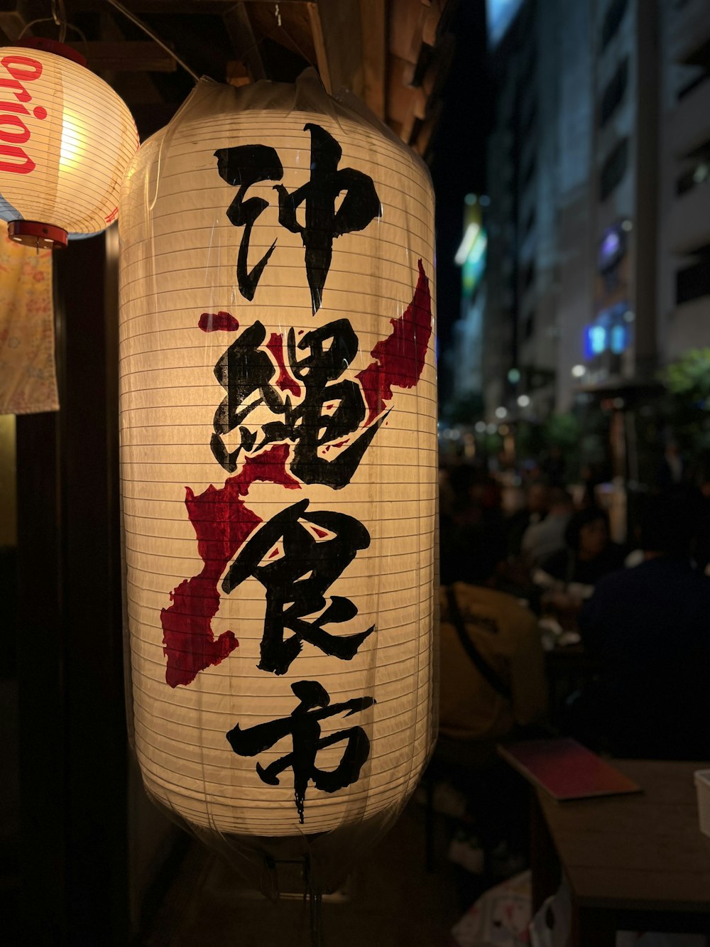 a large lantern with asian writing on it