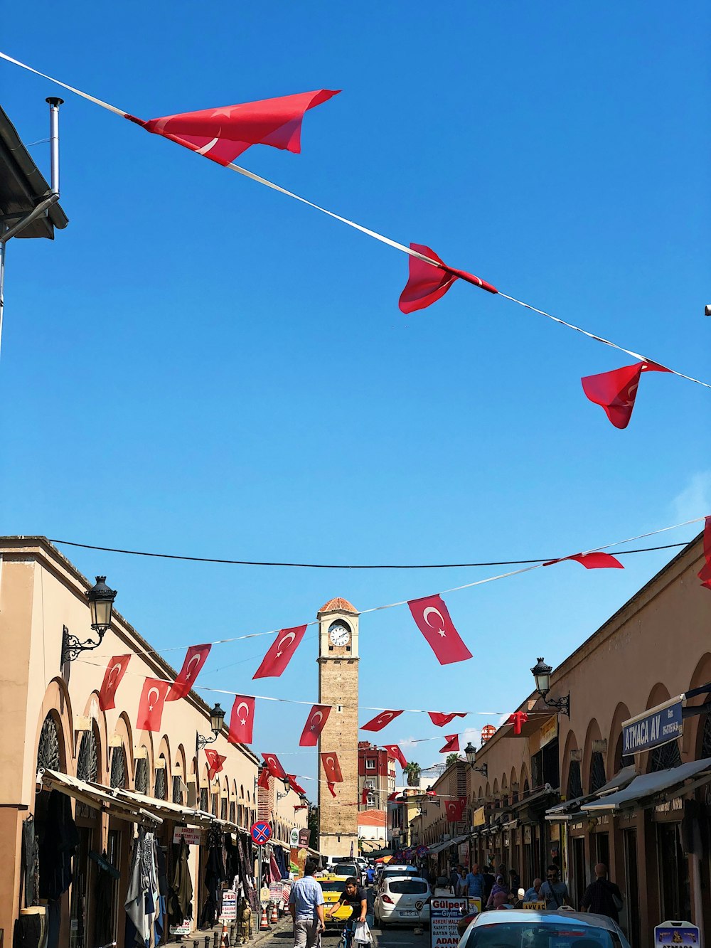 a city street with a clock tower in the background