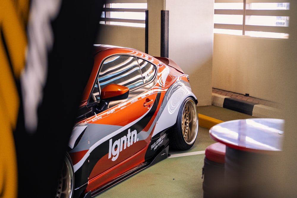 a race car is parked in a garage