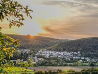 A serene landscape of an Indian village at sunrise, peaceful and inviting.