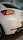 a white car parked in a parking lot