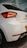 a white car parked in a parking lot