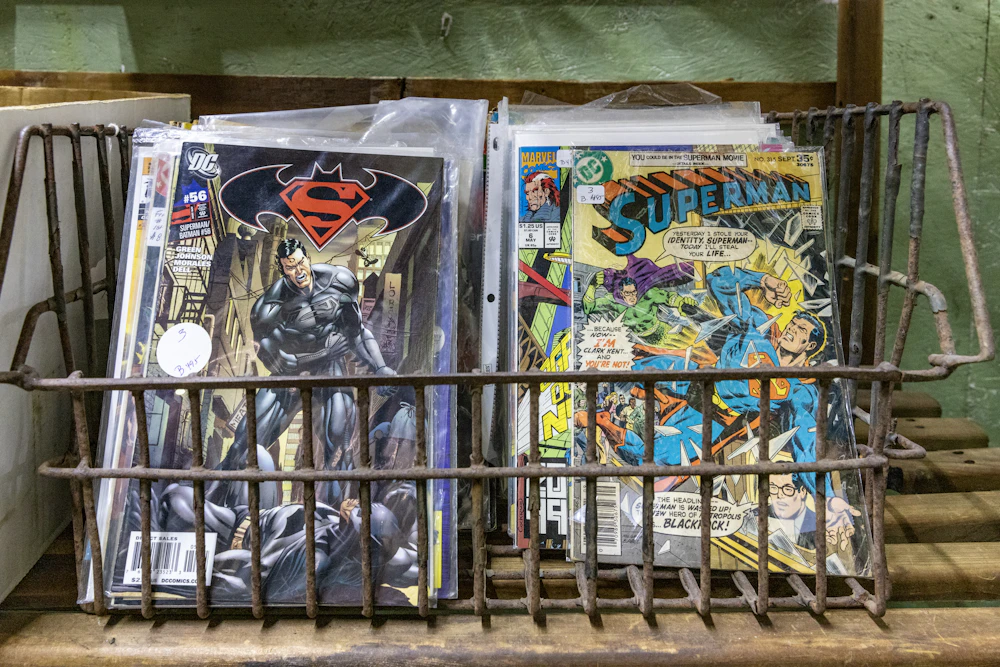 Metal basket holding vintage comic magazines