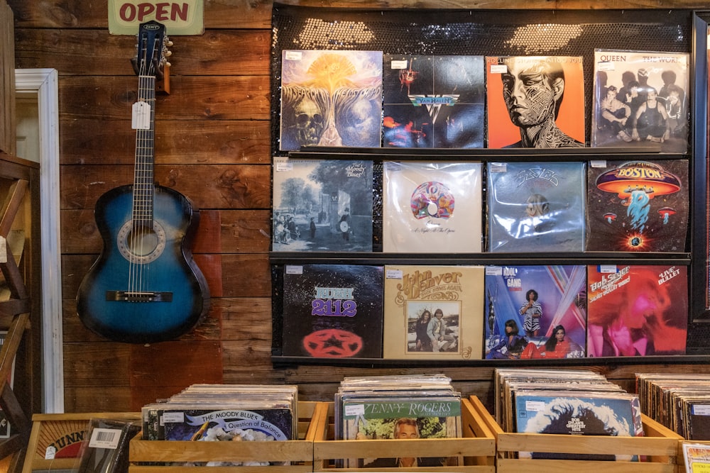 a display of various records and a guitar