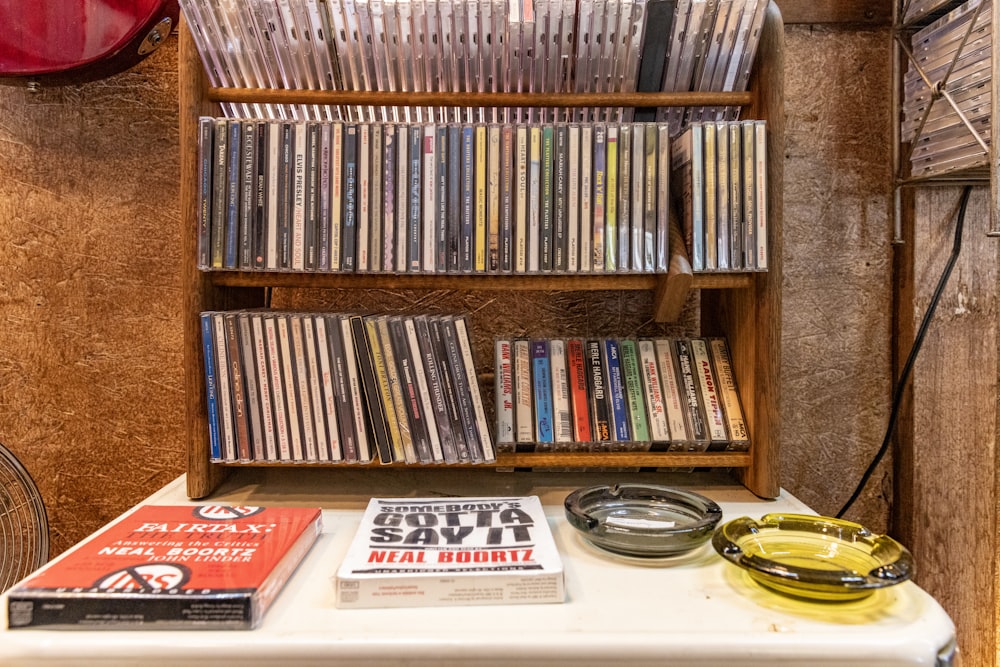 a table with a bunch of cds on top of it