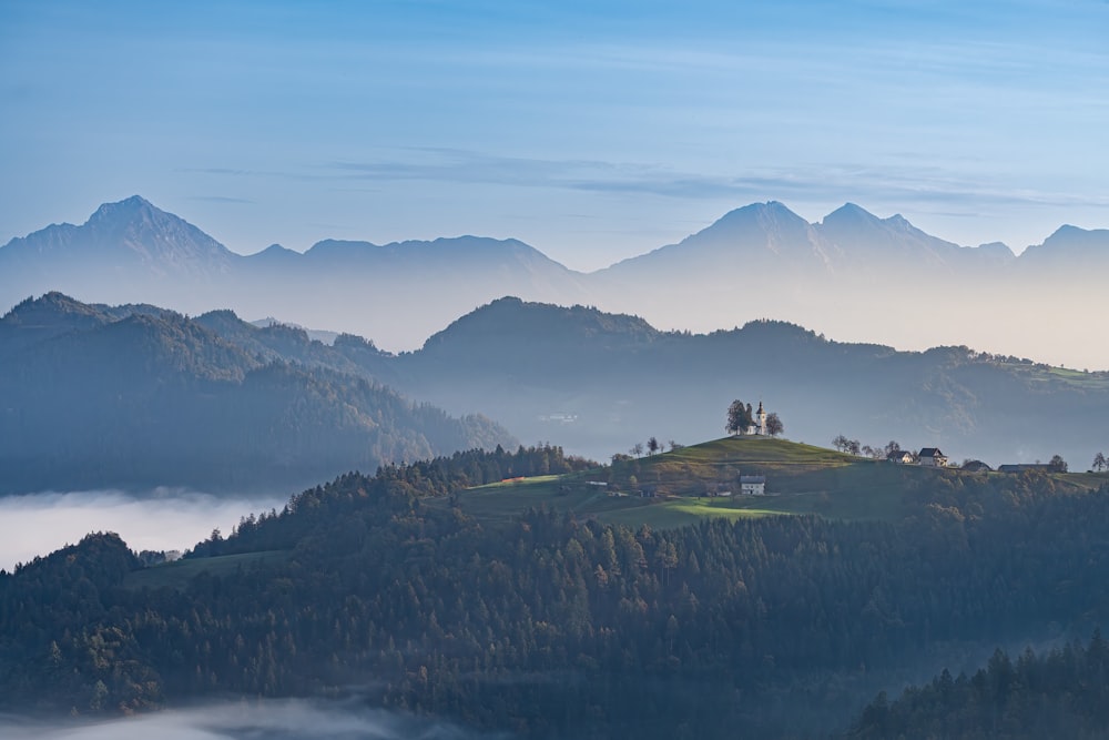 a view of a mountain with a house on top of it