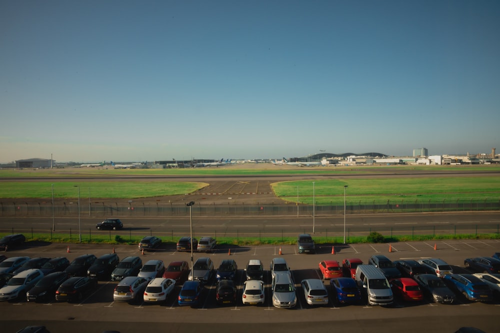 a parking lot filled with lots of parked cars