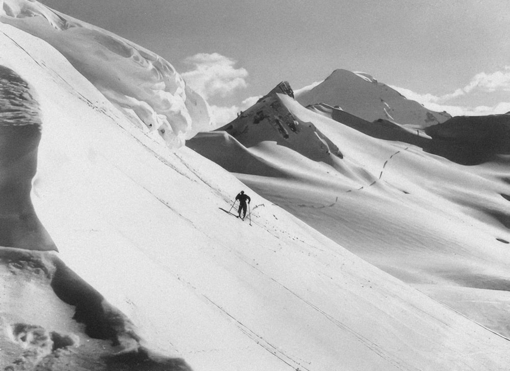 a man skiing down a snow covered mountain