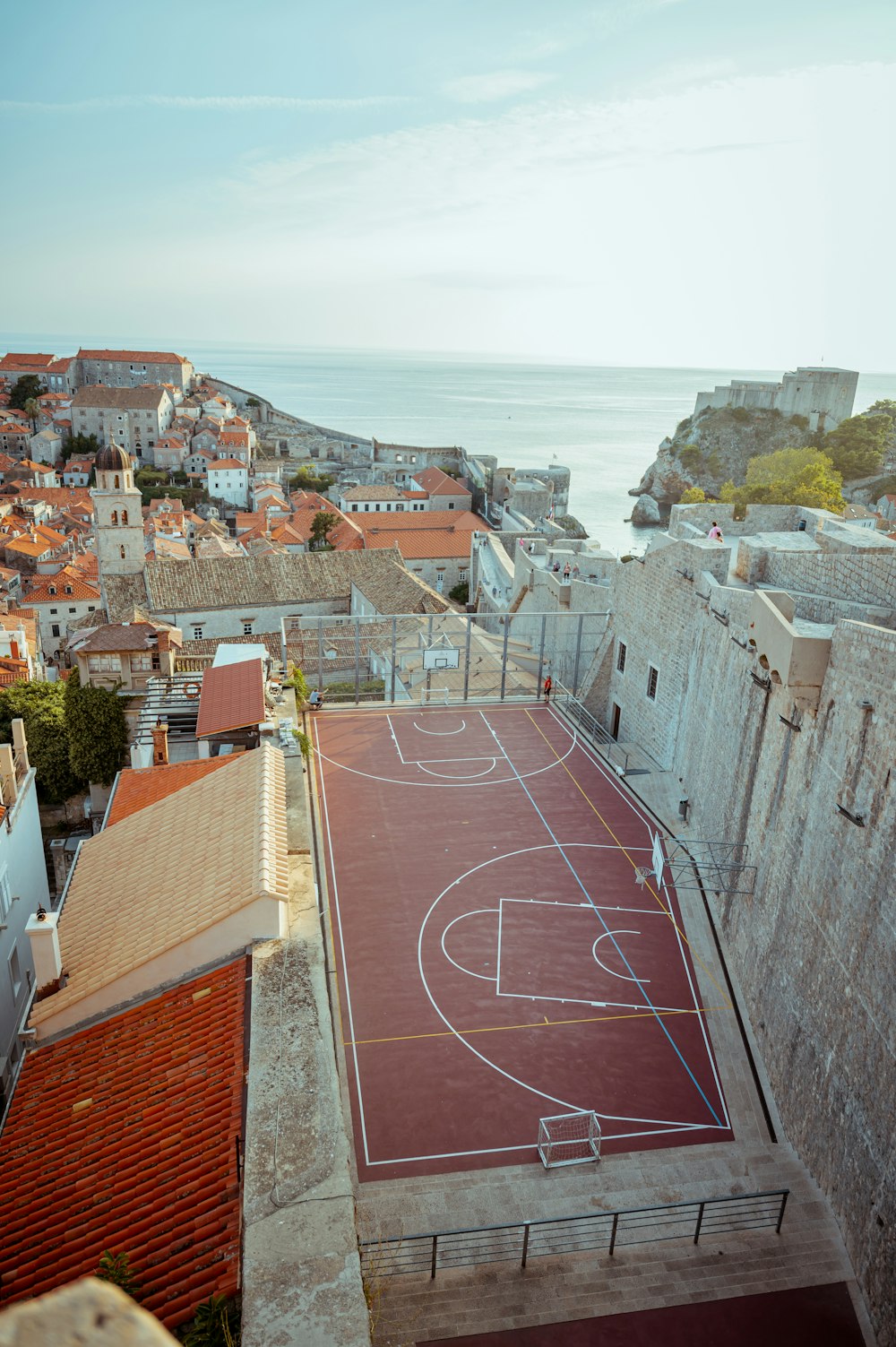 an aerial view of a basketball court in a city