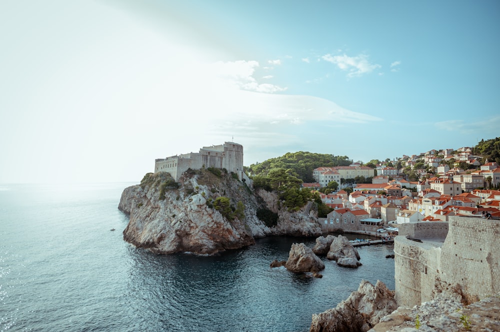 a view of a small town on a rocky shore