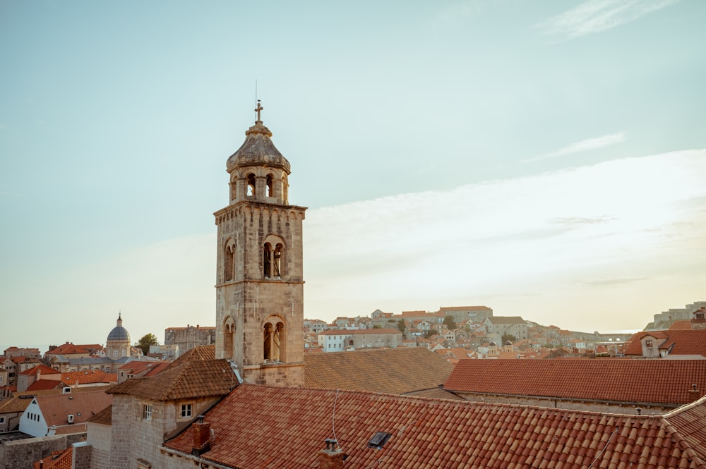 a tall tower with a clock on top of a building