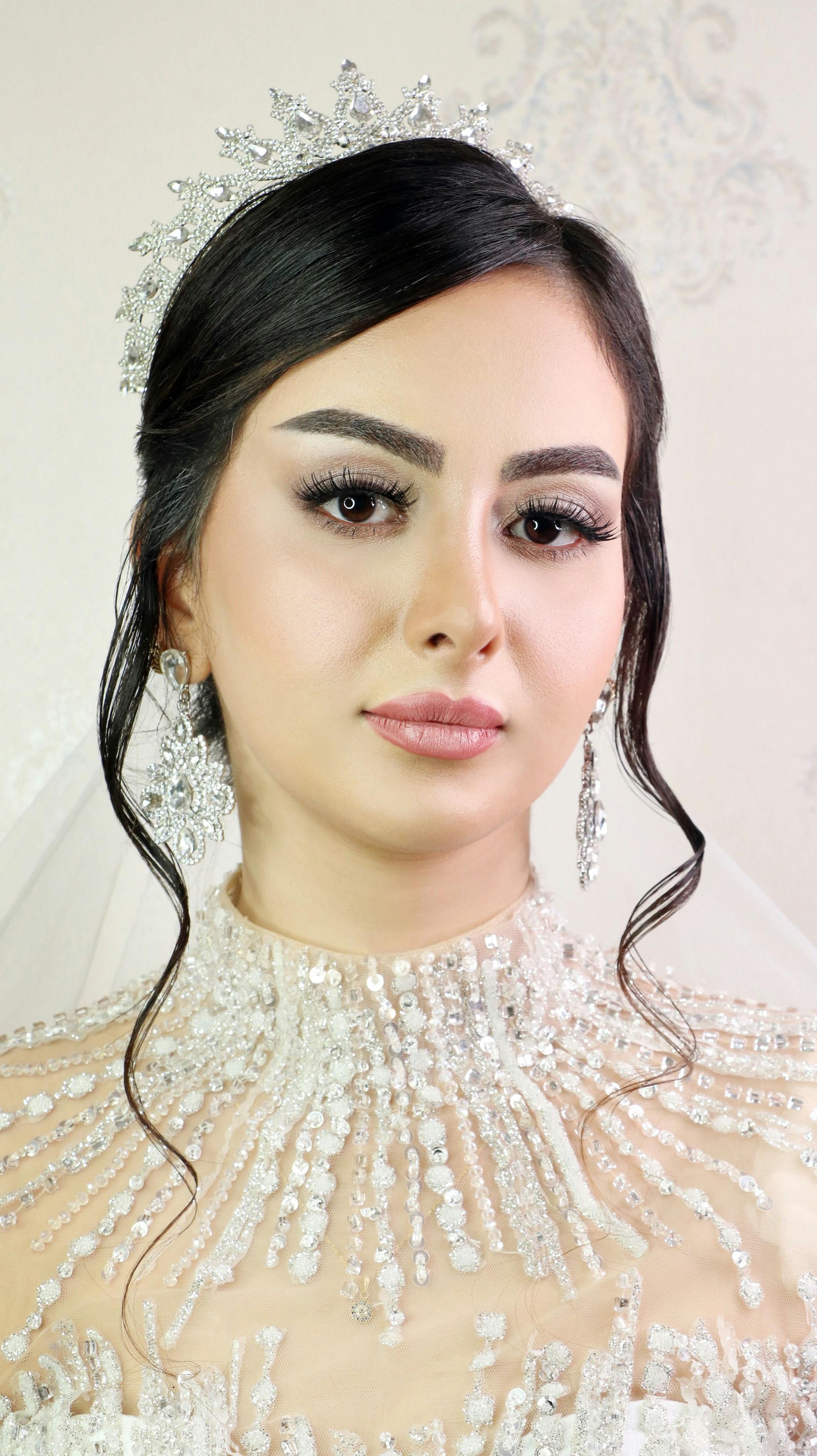 a woman wearing a tiara and a veil