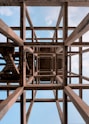 a wooden structure with a sky in the background