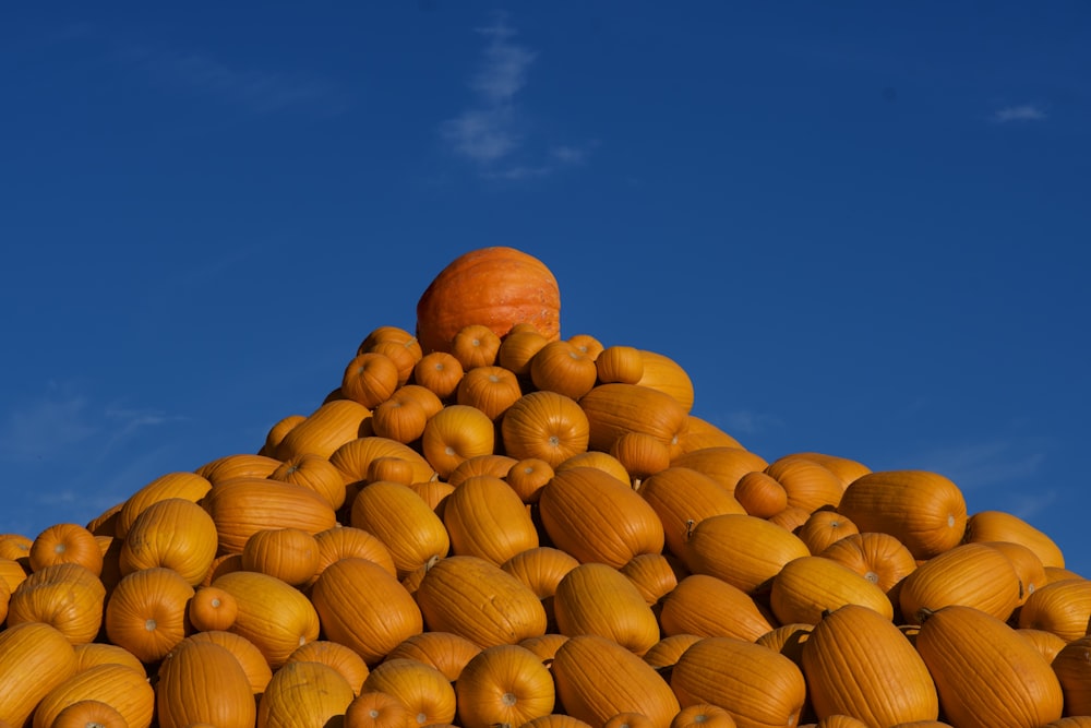 a pile of pumpkins sitting on top of each other