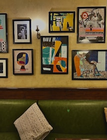 A collection of vibrant wall art pieces displayed in a modern living room.